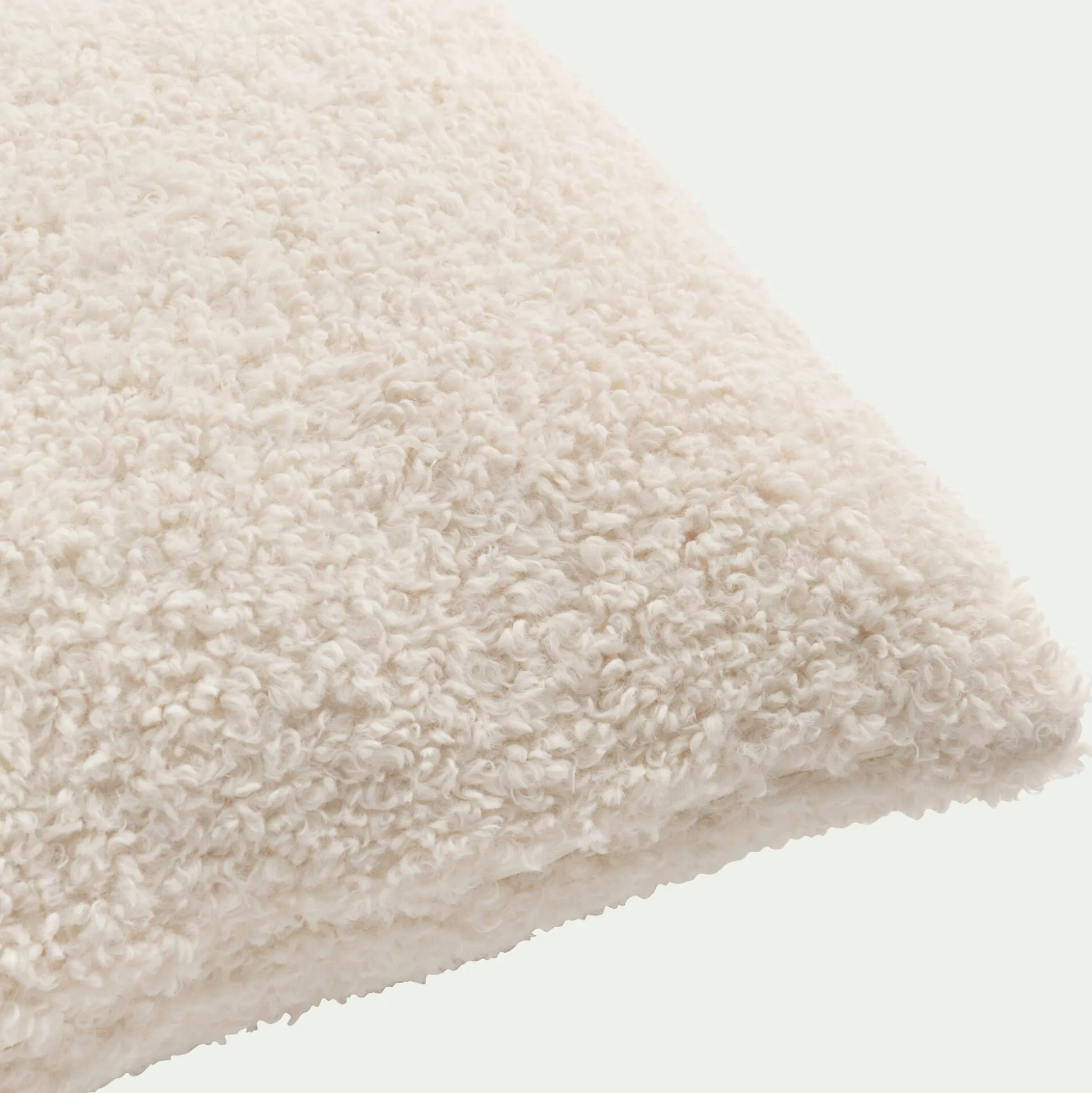 Coussin effet moutonné synthétique 45x45cm - blanc
